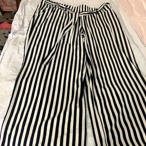 Above ankle, dressy loose fitting Pants.